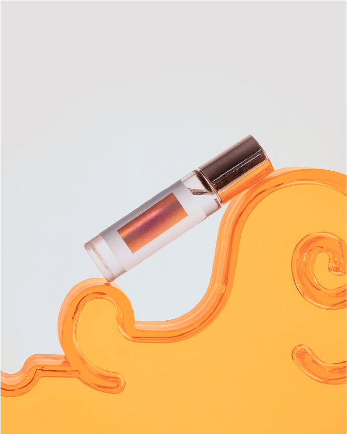 a custom perfumatic oil rests on a surface